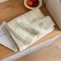 Knitted cream cable knit scarf with a minimalist Vegetable woven logo label - White