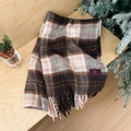 Brown and pink plaid scarf with soft tassels on a cozy winter themed wooden background - Pink Coffee