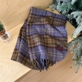 Soft purple and brown plaid winter scarf with thick tassels in a cozy gift setting - Purple