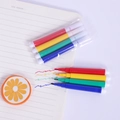 Mini 4-color watercolor pen set for kids painting on a notebook background - Colorful Watercolor Pens