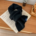 Chunky black knitted scarf with VEGETABLE blue label on a rustic wooden table background - Black / 60-80cm