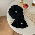 Black 100% pure wool knitted scarf featuring a metallic logo tag and ribbed texture - Black
