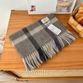 Detail of 100% pure wool checkered scarf with soft fringe on a wooden background - 188x32cm / Dark Gray Beige Plaid (1)