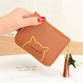 Brown mini cat coin purse with tassel and star charm shown in hand for women - Brown