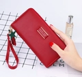 Red long zippered wallet with star tassel and wristlet strap in pebbled leather finish - Burgundy