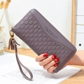 Long zip-around wallet for women in deep purple lychee pattern with tassel and gold hardware - Purple