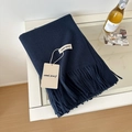 Navy blue wool scarf with fringe edges and premium soft texture in a folded view - 175cm+ / Dark Navy Blue