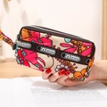 Mini pochette avec imprimé floral d'éléphants, double fermeture éclair et dragonne - Tournesol