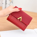 Deep red tri-fold wallet with lychee leather texture and gold V-shaped metal buckle - Red