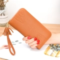 Caramel orange long wallet with maple leaf embossing and tassel detail in lychee leather - Brown