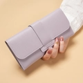 Pale purple long flap wallet in premium leather texture shown held by hand - Purple