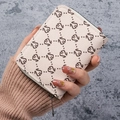 Cream white faux leather card holder with vintage floral pattern and metal zipper - Off White