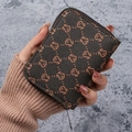Brown monogram card wallet with zipper closure in a compact portable design - Brown