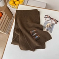 Dark brown knitted wool scarf with cute embroidered dachshund dogs and a cozy texture - Scarf / Mocha