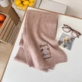 Pink knit wool scarf with dachshund embroidery and dachshund text in a cozy setting - Scarf / Light Pink