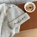 Light gray knitted beanie featuring three embroidered dachshund dogs in a warm wool style - Hat / Light Gray