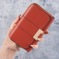 Women's long red-brown faux leather wallet with zipper and elegant metal buckle detail - Brown