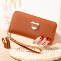 Women's long caramel brown wallet with heart plaque, tassel, and wristlet strap - Brown