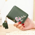 Short dark green PU leather wallet for women with floral embroidery and tassel charm - Green