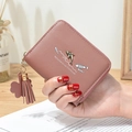 Short mauve wallet with fish print, tassel charm, and golden dolphin metallic accent - Lotus Pink