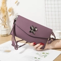 Purple litchi pattern leather crossbody bag with elegant butterfly metal buckle hardware - Purple