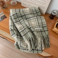 Plaid loop yarn scarf in light green and cream with long tassels on a wooden table - Light Green Grid