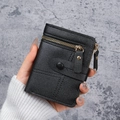 Slim black pebble-grain faux leather short wallet with zip closure and metallic buckle decor - Black
