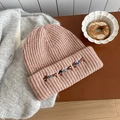 Pink knit beanie featuring detailed dachshund embroidery and thick ribbed wool texture - Hat / Light Pink
