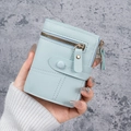 Light blue faux leather short wallet with a front zip pocket and round buckle - Blue