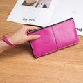 Women's long pebble leather wallet in rose red with zipper closure and wrist strap - Cherry Pink