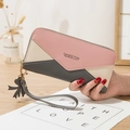 Women's long zip-around wallet with pink and grey patchwork design and wrist strap - Gray