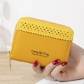 Compact yellow faux leather wallet with laser-cut dots and golden zipper closure - Yellow