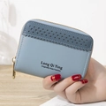 Women's small bi-fold wallet in light blue PU leather with laser-cut details - Blue
