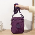 Versatile purple nylon crossbody bag with multiple zip pockets and a durable finish - Deep purple