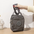 Dark grey nylon crossbody bag for women featuring two zipper pockets and casual style - Gray