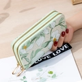 Floral print double zipper wallet in off-white with botanical patterns and wristlet strap - Green