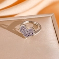 Macro shot of silver heart-shaped ring with purple zircon stones and adjustable band - Purple Heart Ring (8881) / Silver