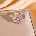 Macro view of adjustable silver ring with pink flower zircon on golden jewelry box - Silver Ring (8883)