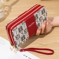 Portefeuille long rouge pour femme à double fermeture éclair et dragonne - Bordeaux