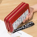 Long double-zipper wallet for women featuring red floral patterns and a LOVE strap - Wine Red