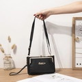 Bolso bandolera negro con textura de lichi, cierre dorado y correa ajustable elegante - Negro