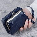 Dark blue leather wallet with wristlet strap and dual compartment metal frame closure - Dark Blue