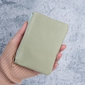 Light green pebble leather mini wallet with gold zipper and compact hand-held design - Green