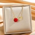 Elegant gold infinity necklace with red rose and zircon accents on silk background - Infinity Symbol Rose Necklace (10664)