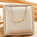 Golden sparkling zircon clover necklace with rectangular pendant on champagne silk display - Gold Old Flower Strap Style (8890)