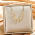 Golden clover necklace with sparkling cubic zirconia on a luxury jewelry display box - Gold Four-Leaf Flower Style (8890)