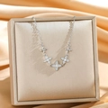 Silver clover necklace with sparkling zircons hanging on a silk jewelry box - Silver Four-Leaf Flower Style (8890)