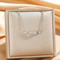 Close-up of silver planet pendant necklace with zircon pavé on champagne jewelry box - Silver Planet Old Flower Style (8890)