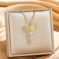 Elegant gold titanium necklace featuring a sparkling butterfly pendant with tassels - Gold Tassel Butterfly Style (8896)