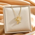 Elegant gold butterfly zircon necklace with rectangular stone on a satin display stand - Gold Butterfly